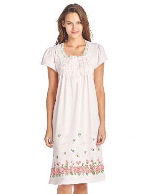 Casual Nights Women's Fancy Lace Flower Short Sleeve Nightgown  - Pink - Please use this size chart to determine which size will fit you best, if your measurements fall between two sizes we recommend ordering a larger size as most people prefer their sleepwear a little looser. Medium: Measures US Size 2-4, Chests/Bust 34"-35" Large: Measures US Size 68, Chests/Bust 35-36" X-Large: Measures US Size 10-12, Chests/Bust 37-38" XX-Large: Measures US Size 12-14, Chests/Bust 38.5-40" This fresh and Feminine Pullover Nightshirt from Casual Nights Lounge and sleepwear Collection, designed in polka dot pretty print. Features: short sleeves, scoop neck, lace at neck, flower printed border, 5 button closure, approx. 39 length, youll love slipping on and feel comfortable to wear around the house or to sleep in. 