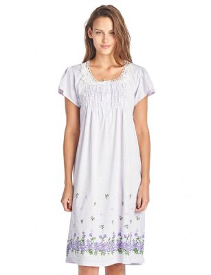 Casual Nights Women's Fancy Lace Flower Short Sleeve Nightgown  - Purple - Please use this size chart to determine which size will fit you best, if your measurements fall between two sizes we recommend ordering a larger size as most people prefer their sleepwear a little looser. Medium: Measures US Size 2-4, Chests/Bust 34"-35" Large: Measures US Size 68, Chests/Bust 35-36" X-Large: Measures US Size 10-12, Chests/Bust 37-38" XX-Large: Measures US Size 12-14, Chests/Bust 38.5-40" This fresh and Feminine Pullover Nightshirt from Casual Nights Lounge and sleepwear Collection, designed in polka dot pretty print. Features: short sleeves, scoop neck, lace at neck, flower printed border, 5 button closure, approx. 39 length, youll love slipping on and feel comfortable to wear around the house or to sleep in. 