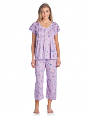 Casual Nights Women's Short Sleeve Capri Pajama Set - Purple - Please use this size chart to determine which size will fit you best, if your measurements fall between two sizes we recommend ordering a larger size as most people prefer their sleepwear a little looser. Medium: Measures US Size 2-4, Chests/Bust 34"-35" Large: Measures US Size 68, Chests/Bust 35-36" X-Large: Measures US Size 10-12, Chests/Bust 37-38" XX-Large: Measures US Size 12-14, Chests/Bust 38.5-40"  1X: Measures US Size 10-12, Chests/Bust 37-39" 2X: Measures US Size 12-14, Chests/Bust 38-41" 3X: Measures US Size 16-18, Chests/Bust 41.5-43" 4X: Measures US Size 18-20, Chests/Bust 43-45" Hit the sack in total comfort with these Soft and lightweight Cotton Blend Pajamas in a fun pattern Capri Length Pants with an elastic drawstring waist for easy pull on, pant inseam length approximately 21", Shirt Features: Cap Sleeves, round neck, 5 Button closure, ribbon details for the extra feminine touch. A comfortable straight fit perfect for sleeping or lounging around.