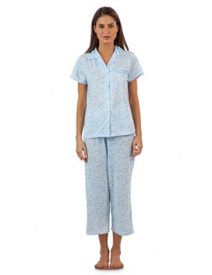 Casual Nights Lace Trim Women's Short Sleeve Capri Pajama Set - Spring Blue - Size recommendation: Size Medium (4-6) Large (8-10) X-Large (12-14) XX-Large (16-18), Order one size up For a more Relaxed FitHit the sack in total comfort with these Soft and lightweight Cotton Blend Pajamas in a fun spring patterns Capri Length Pants with an elastic drawstring waist for easy pull on, pant inseam length approximately 21", Shirt Features: Short Sleeves, Notch collar, handy patch pocket, Button down closure, lace and ribbon details for the extra feminine touch. A comfortable relaxed fit perfect for sleeping or lounging around.