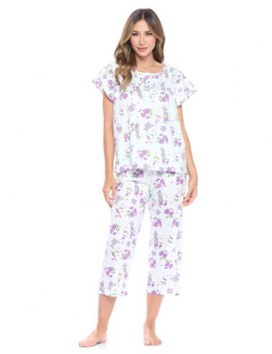 Casual Nights Women's Short Sleeve Floral Capri Pajama Set - Mint Green/Purple - Please use this size chart to determine which size will fit you best, if your measurements fall between two sizes we recommend ordering a larger size as most people prefer their sleepwear a little looser. Top Length 25", Capri Pants Inseam 21"Medium: Measures US Size 4-6, Chests/Bust 34"-35" Large: Measures US Size 8-10, Chests/Bust 35-36" X-Large: Measures US Size 12-14, Chests/Bust 37-38" XX-Large: Measures US Size 16-18, Chests/Bust 38.5-40"  3X-Large: Measures US Size 18-20, Chests/Bust 41.5-43" 4X-Large: Measures US Size 20-22, Chests/Bust 43-45"Soft and lightweight Cotton Poly Knit Capri Pajama 2 piece Sleep Set in a fun floral pattern. Short sleeve shirt features: Scoop neck, 4 button placket closure, lace and smocked trim detail, Pajama pants with elasticized waist and drawstring for easy pull on and added comfort, approx. 21" inseam length. PJ's Set offers A comfortable fit perfect for sleeping or lounging around.