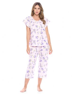 Casual Nights Women's Short Sleeve Floral Capri Pajama Set - Pink/Purple - Please use this size chart to determine which size will fit you best, if your measurements fall between two sizes we recommend ordering a larger size as most people prefer their sleepwear a little looser. Top Length 25", Capri Pants Inseam 21"Medium: Measures US Size 4-6, Chests/Bust 34"-35" Large: Measures US Size 8-10, Chests/Bust 35-36" X-Large: Measures US Size 12-14, Chests/Bust 37-38" XX-Large: Measures US Size 16-18, Chests/Bust 38.5-40"  3X-Large: Measures US Size 18-20, Chests/Bust 41.5-43" 4X-Large: Measures US Size 20-22, Chests/Bust 43-45"Soft and lightweight Cotton Poly Knit Capri Pajama 2 piece Sleep Set in a fun floral pattern. Short sleeve shirt features: Scoop neck, 4 button placket closure, lace and smocked trim detail, Pajama pants with elasticized waist and drawstring for easy pull on and added comfort, approx. 21" inseam length. PJ's Set offers A comfortable fit perfect for sleeping or lounging around.