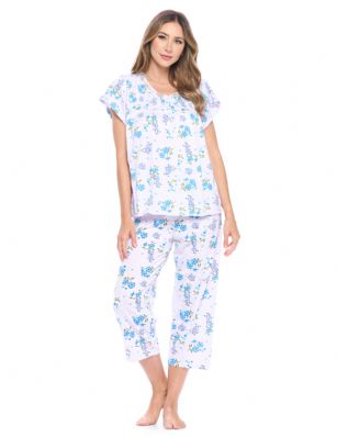Casual Nights Women's Short Sleeve Floral Capri Pajama Set - Purple/Blue - Please use this size chart to determine which size will fit you best, if your measurements fall between two sizes we recommend ordering a larger size as most people prefer their sleepwear a little looser. Top Length 25", Capri Pants Inseam 21"Medium: Measures US Size 4-6, Chests/Bust 34"-35" Large: Measures US Size 8-10, Chests/Bust 35-36" X-Large: Measures US Size 12-14, Chests/Bust 37-38" XX-Large: Measures US Size 16-18, Chests/Bust 38.5-40"  3X-Large: Measures US Size 18-20, Chests/Bust 41.5-43" 4X-Large: Measures US Size 20-22, Chests/Bust 43-45"Soft and lightweight Cotton Poly Knit Capri Pajama 2 piece Sleep Set in a fun floral pattern. Short sleeve shirt features: Scoop neck, 4 button placket closure, lace and smocked trim detail, Pajama pants with elasticized waist and drawstring for easy pull on and added comfort, approx. 21" inseam length. PJ's Set offers A comfortable fit perfect for sleeping or lounging around.