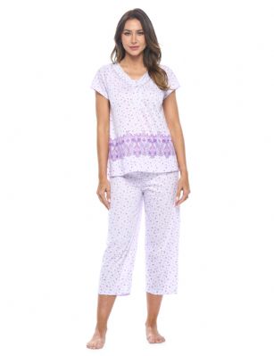 Casual Nights Women's Short Sleeve Floral Capri Pajama Set - Purple - Please use this size chart to determine which size will fit you best, if your measurements fall between two sizes we recommend ordering a larger size as most people prefer their sleepwear a little looser. Top Length 25", Capri Pants Inseam 21"Medium: Measures US Size 2-4, Chests/Bust 32"-34" Large: Measures US Size 4-6, Chests/Bust 34-35" X-Large: Measures US Size 8-10, Chests/Bust 35-36" XX-Large: Measures US Size 10-12, Chests/Bust 37"-38.5" Soft and lightweight Cotton Poly Knit Capri Pajama 2 piece Sleep Set in a fun floral pattern. Short sleeve shirt features: Scoop neck, 4 button placket closure, lace and smocked trim detail, Pajama pants with elasticized waist and drawstring for easy pull on and added comfort, approx. 21" inseam length. PJ's Set offers A comfortable fit perfect for sleeping or lounging around.