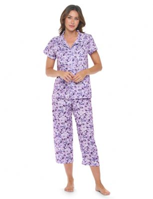 Casual Nights Women's Super Soft Capri Pajamas Set, Short Sleeve Button Down Shirt with Pants PJ Set with Pockets - Floral Purple - Soft and lightweight Rayon Knit Pajamas in a fun prints and patterns, coziest pajamas you'll ever own. Features Button down closure with notch collar, matching easy pull on pajama pants with elastic waistband for added comfort, These pj's offer comfortable straight fit perfect for sleeping or curling up on the couch to watch a movie.Please use our size chart to determine which size will fit you best, if your measurements fall between two sizes we recommend ordering a larger size as most people prefer their sleepwear a little looser.Medium: Measures US Size 2-4, Chests/Bust 32"-34" Large: Measures US Size 4-6, Chests/Bust 34-35" X-Large: Measures US Size 8-10, Chests/Bust 35-36" XX-Large: Measures US Size 10-12, Chests/Bust 37"-38.5" 
